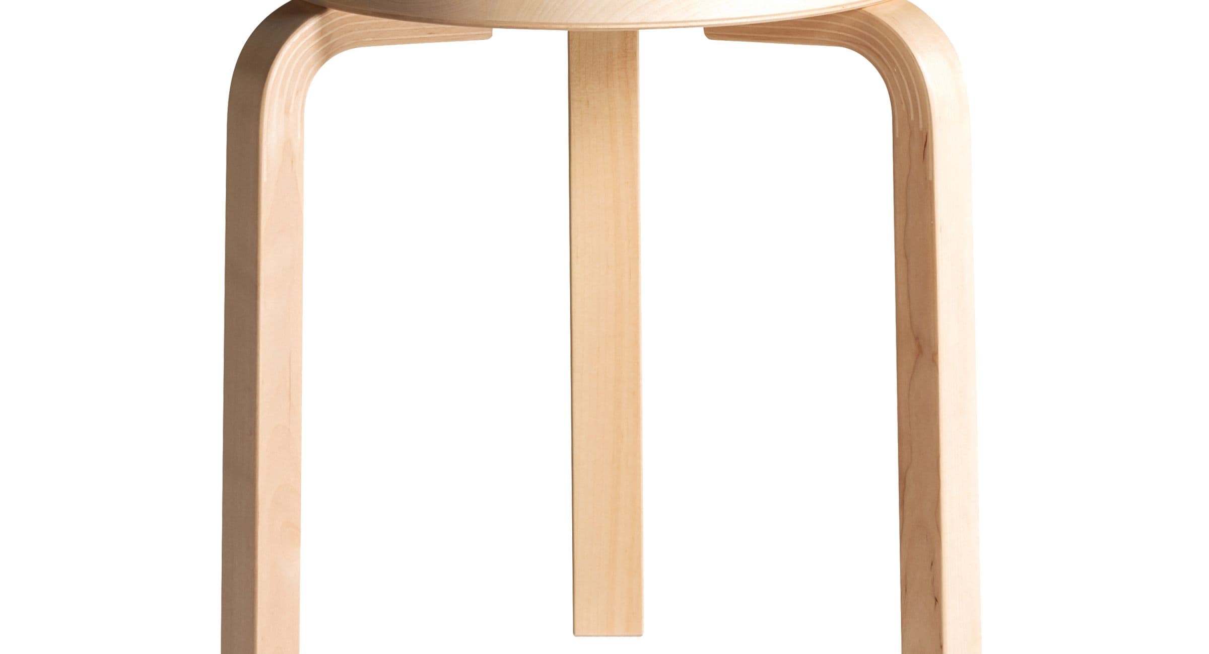 Close view from below of the pale birch bent legs and round seat of Artek’s Stool 60 against white.