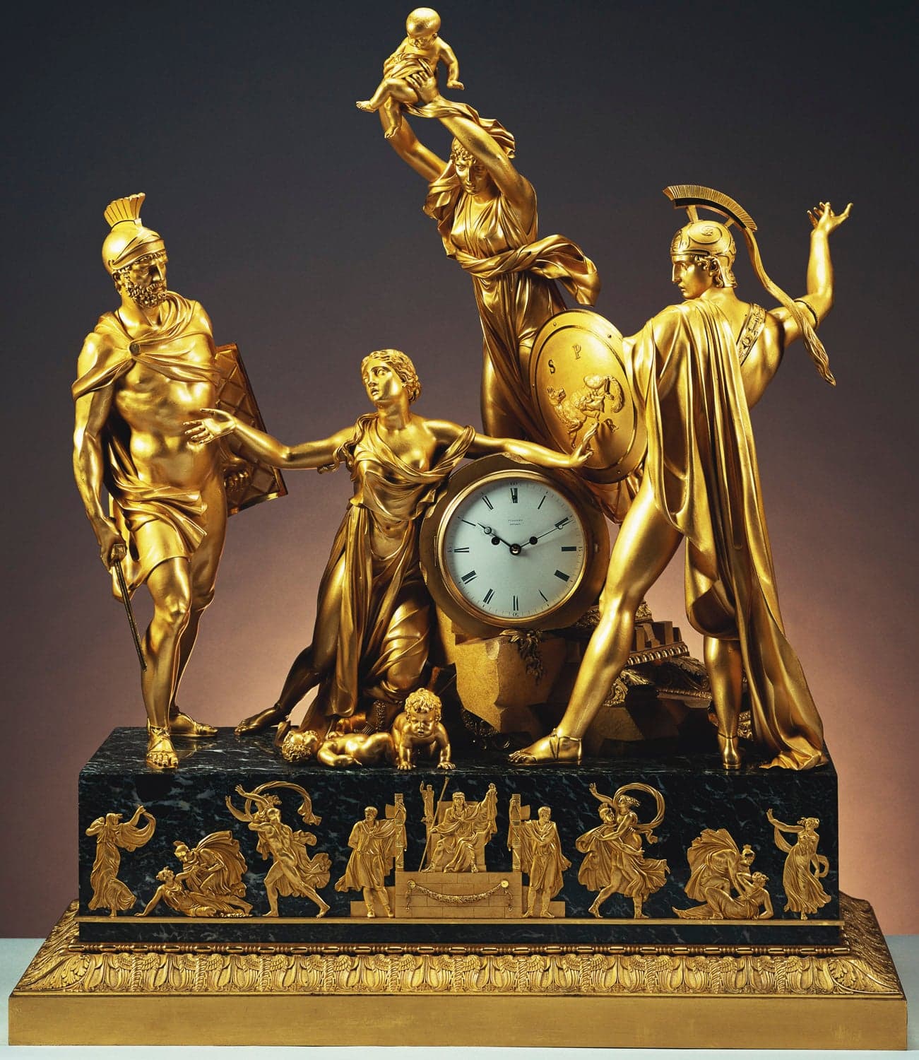 Breguet’s gilded 1814 Sympathique clock with classical figures surrounding its dial and watch cradle.