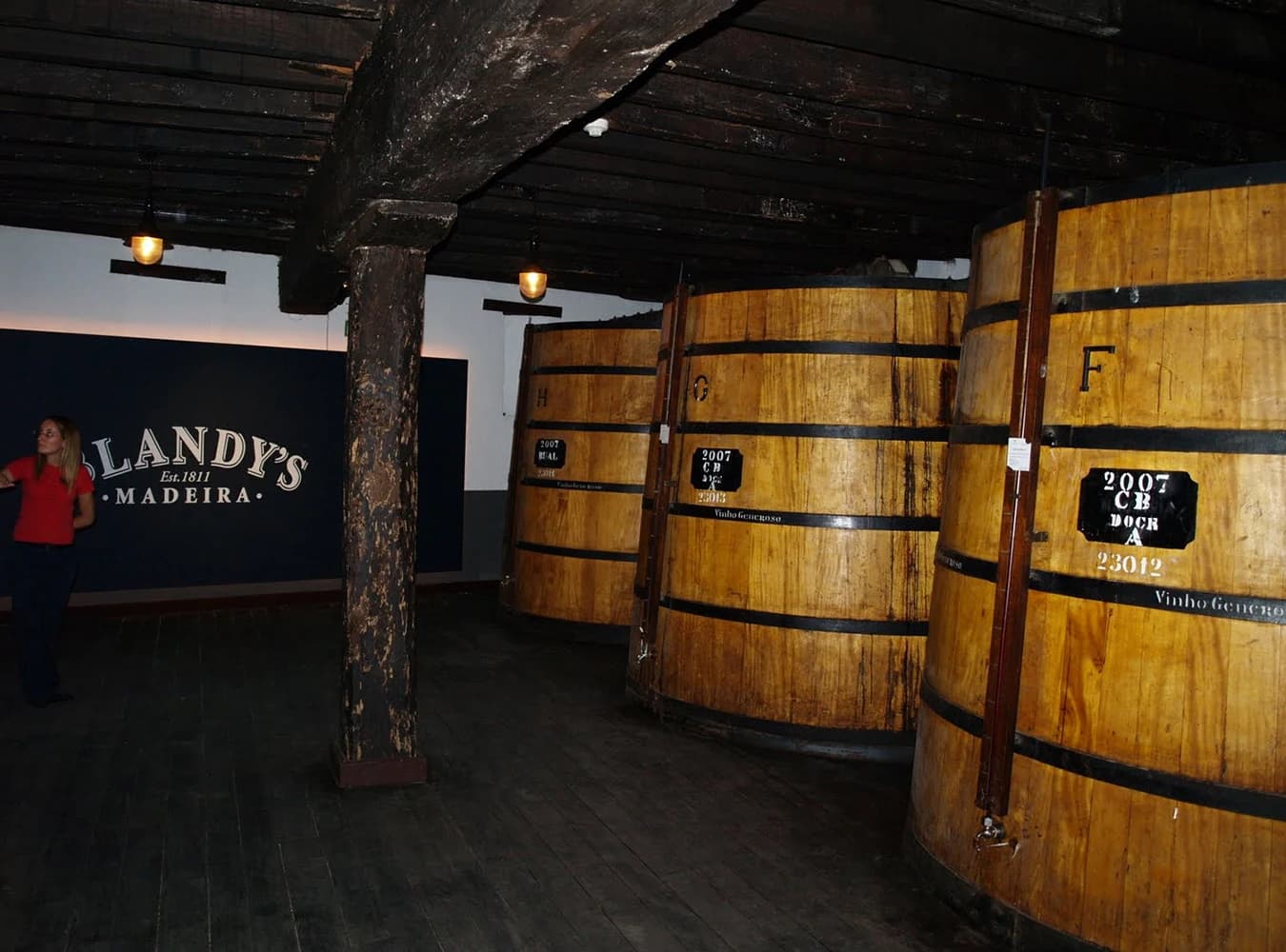 Wooden vats at Blandy’s in the importer’s cellar photograph, illustrating the producer rather than a particular Malmsey batch.