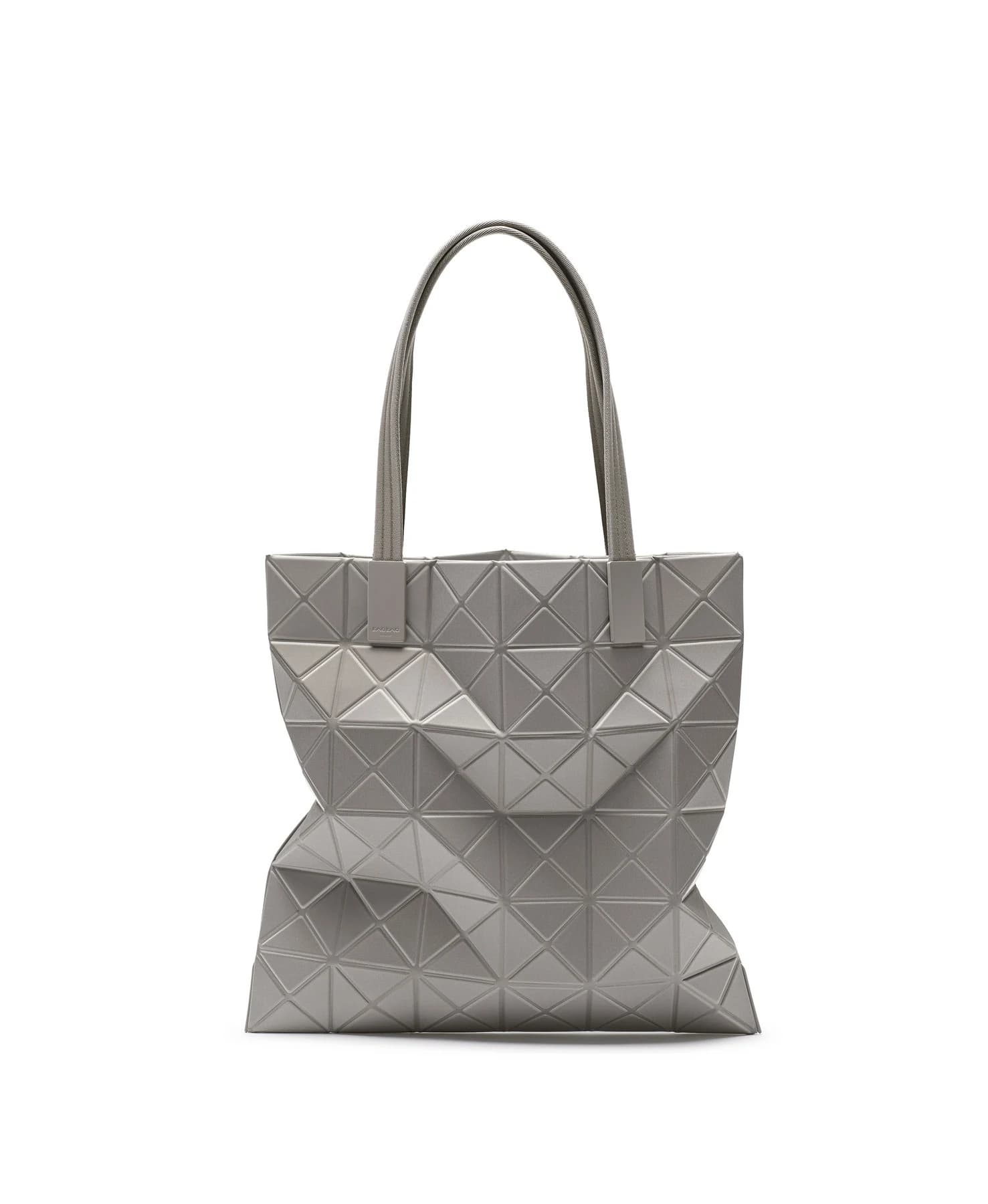 A complete grey BAO BAO ISSEY MIYAKE TRACK tote on white, with long handles and a triangular structure forming folds within the fabric surface.
