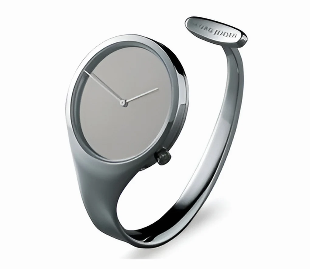 A polished silver-coloured Vivianna watch with an unnumbered mirrored dial and a curved open bangle against a white background.