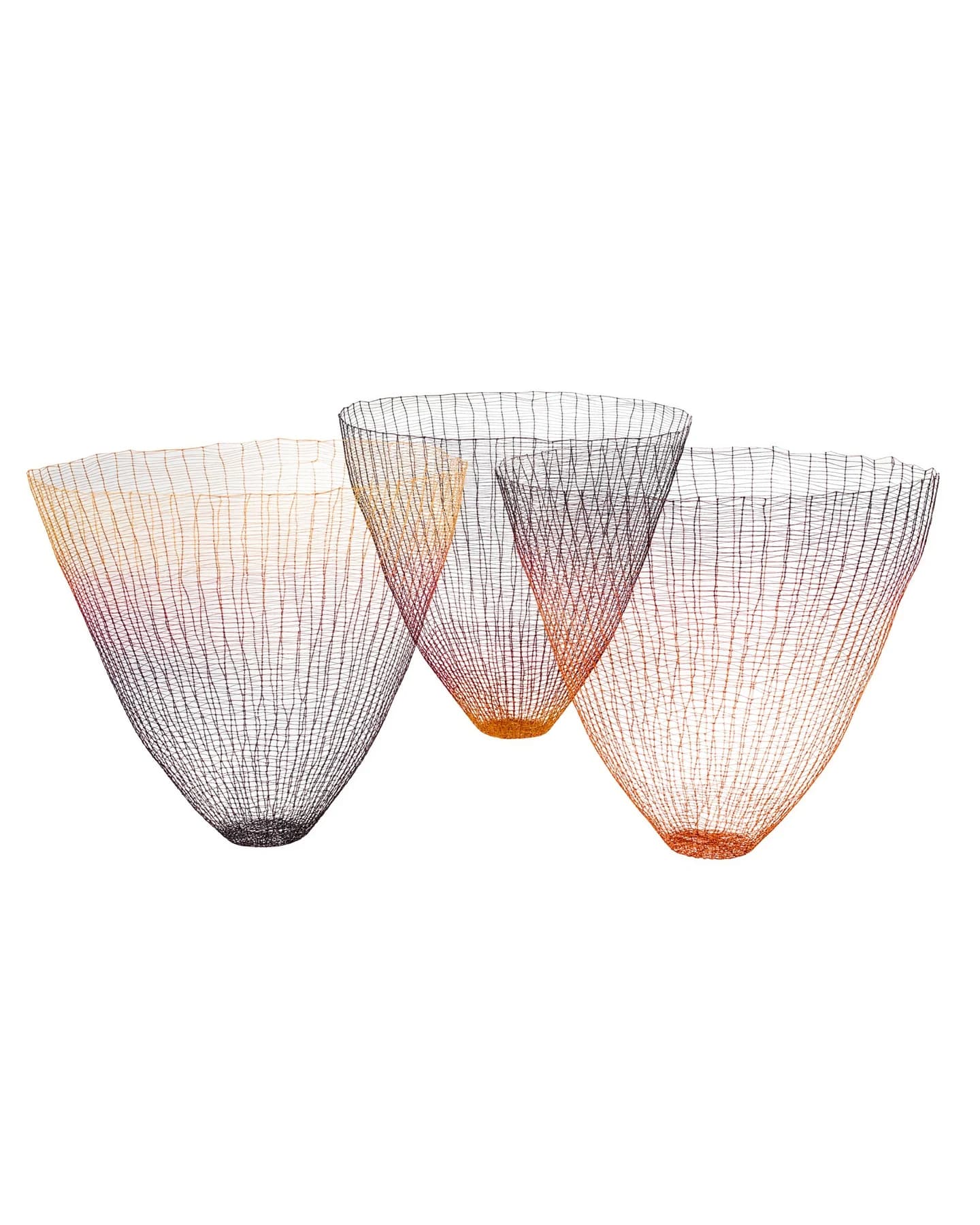 Three open-mesh vessels by Gjertrud Hals, formed from fine coloured threads with rounded lower ends and wide rims, shown together against white.