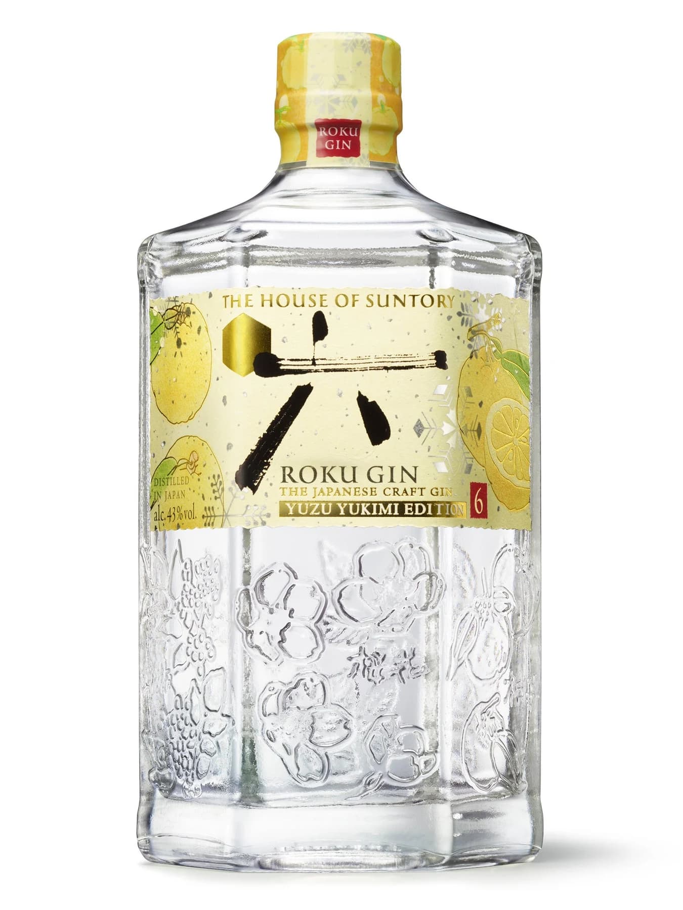 A clear ROKU Yuzu Yukimi Edition gin bottle with a yellow cap and illustrated yuzu label, photographed against white.