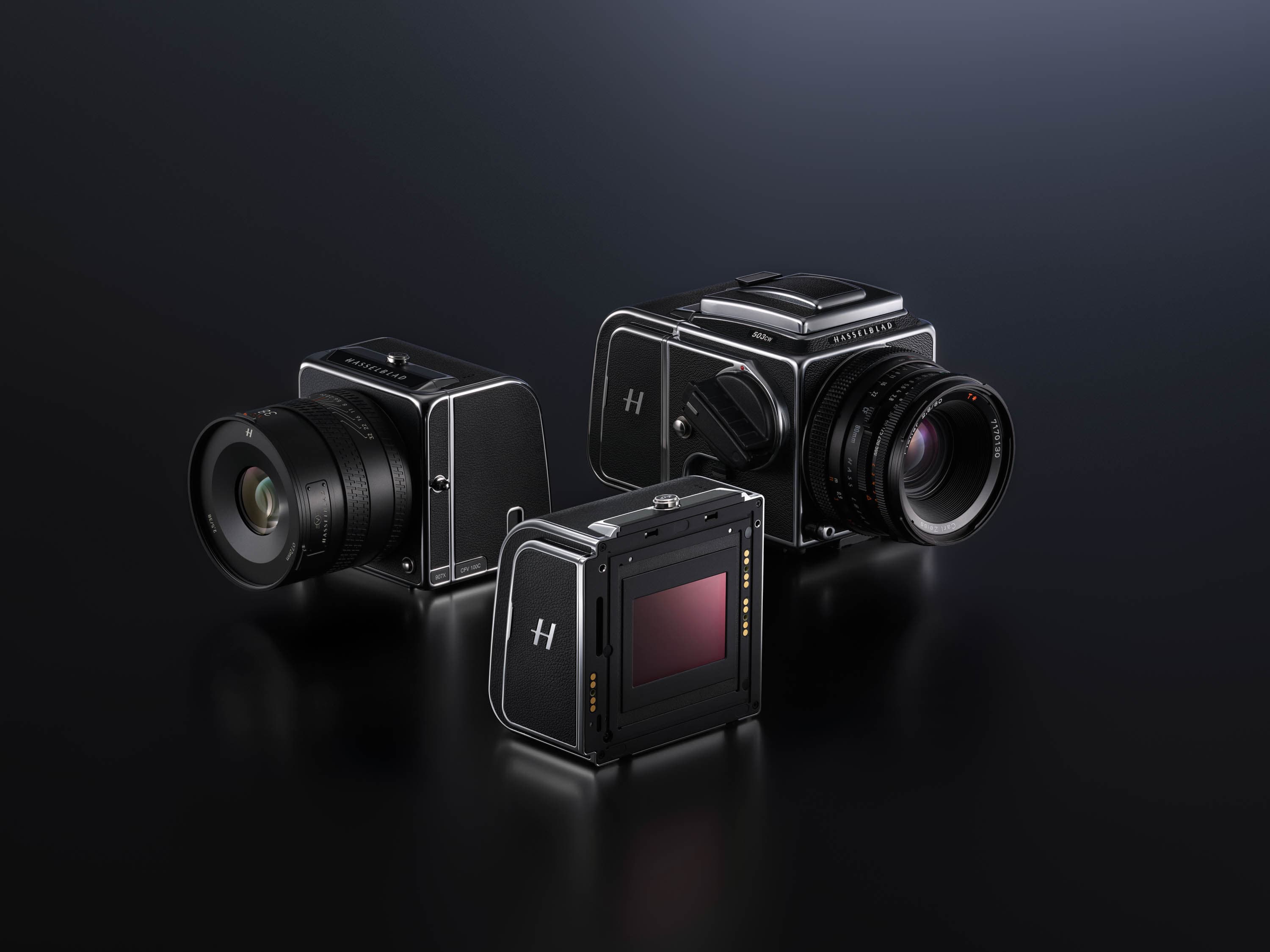 A Hasselblad CFV 100C digital back shown beside current and classic V System camera configurations.