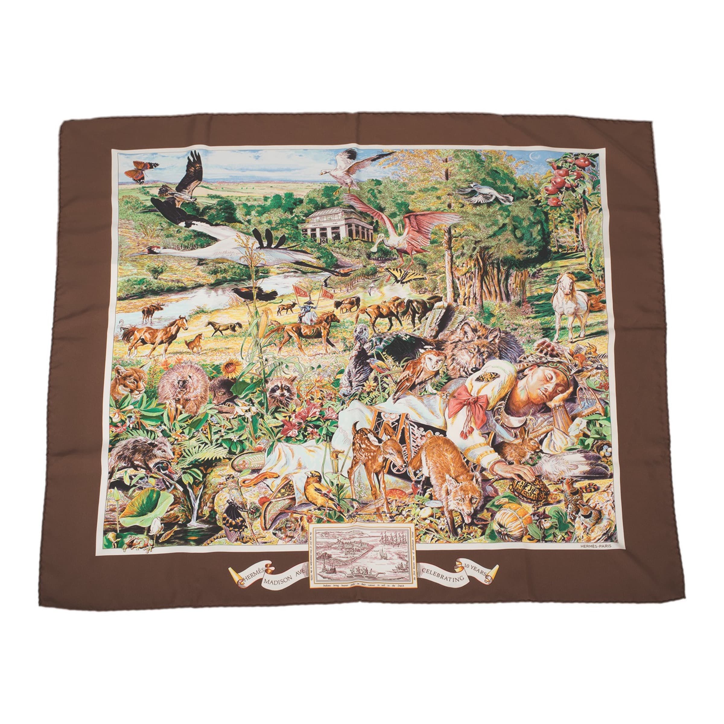 Kermit Oliver’s richly illustrated Hermès Madison Avenue silk scarf laid flat against white.