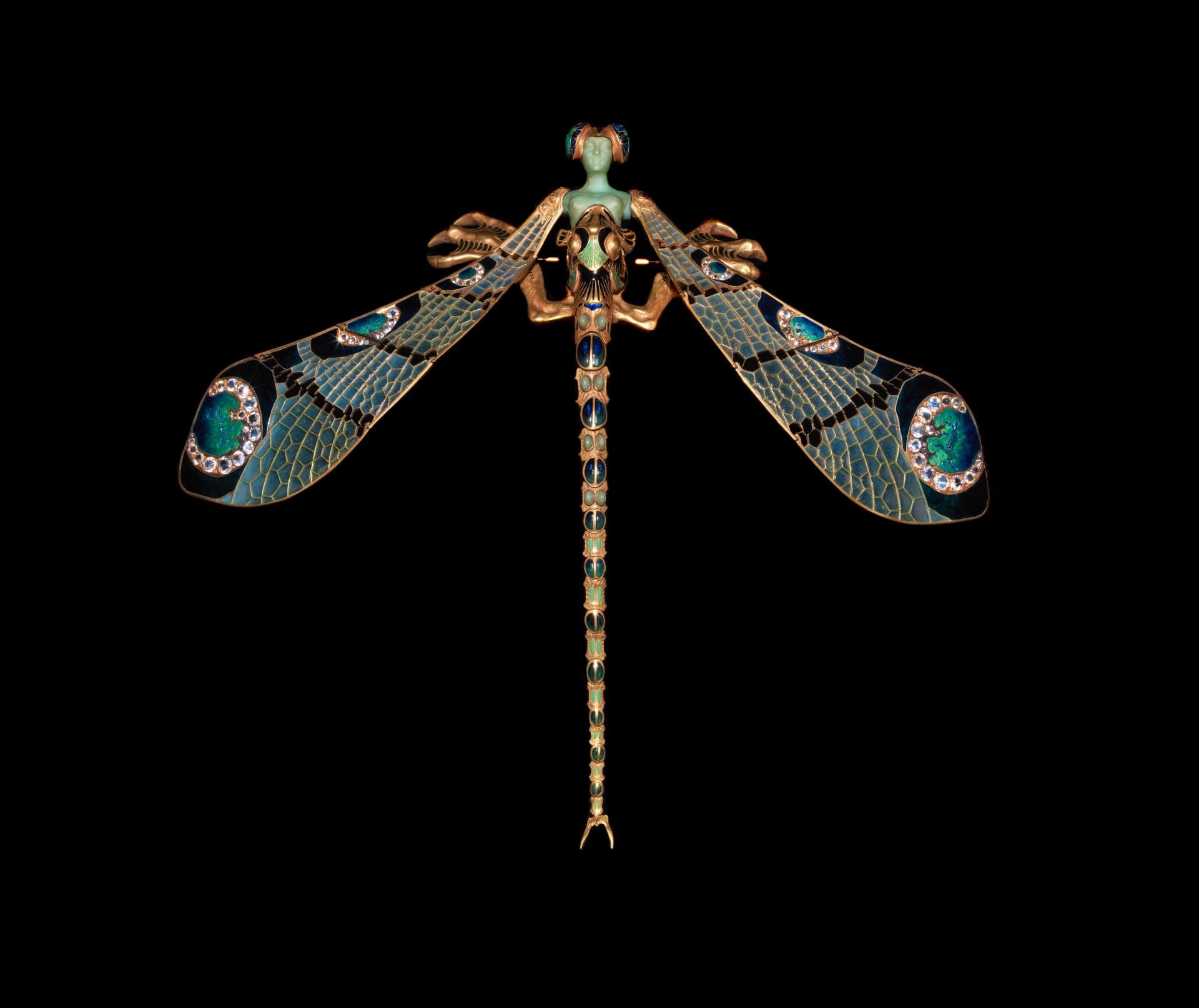 René Lalique’s dragonfly-woman ornament with outstretched blue-green enamel wings and a green female figure.