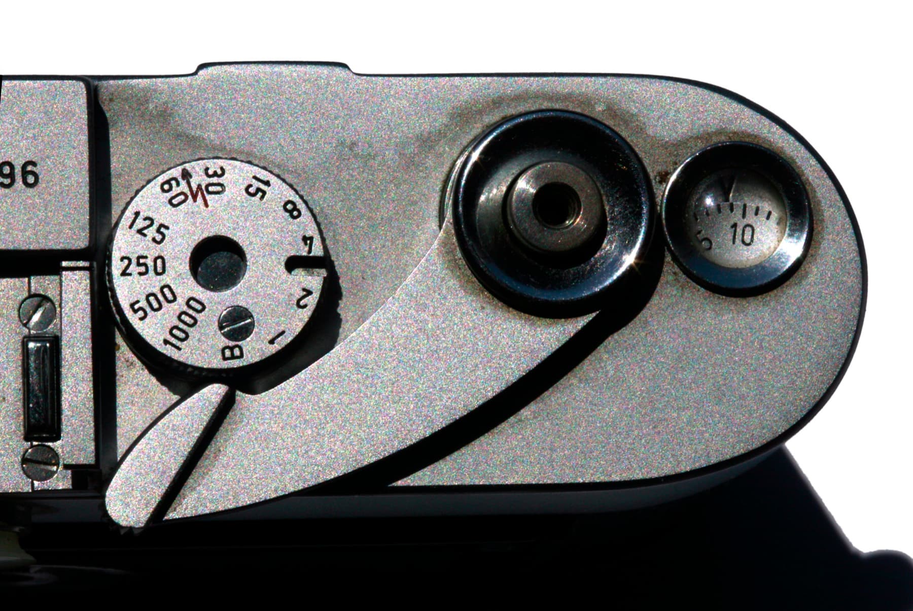 Close overhead detail of a silver Leica M3 camera showing the shutter dial, advance lever and frame counter.