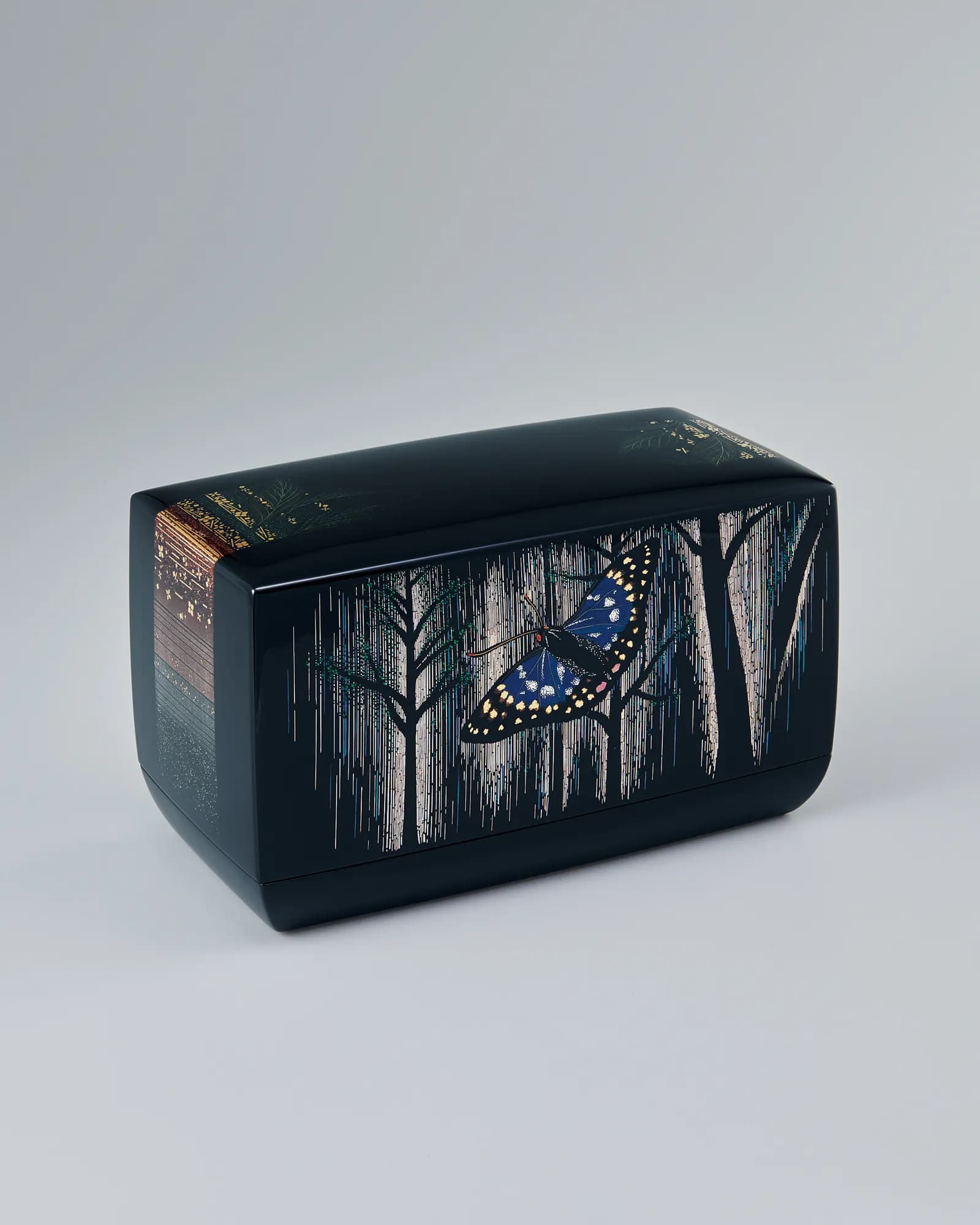 Keiji Onihira’s black lacquer box with a luminous butterfly and foliage worked across its lid.