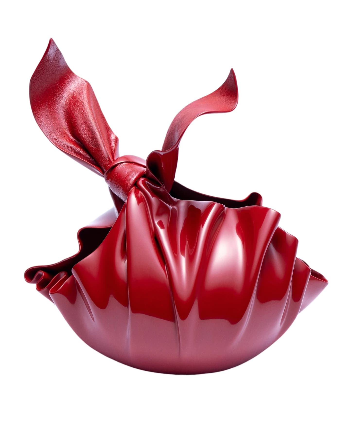 Nan Wei’s Knot-Loving, a glossy red looping sculpture made with cow leather, linen and lacquer, photographed on a neutral background with a soft shadow.